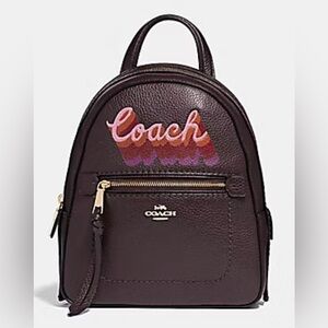 COACH ANDI BACKPACK WITH NEON COACH SCRIPT - 
OXBLOOD MULTI